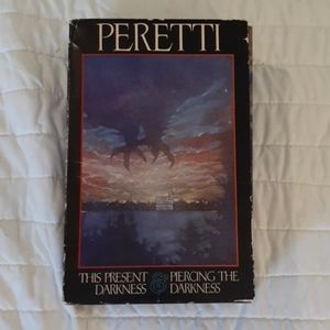 THIS PRESENT DARKNESS AND PIERCING THE DARKNESS